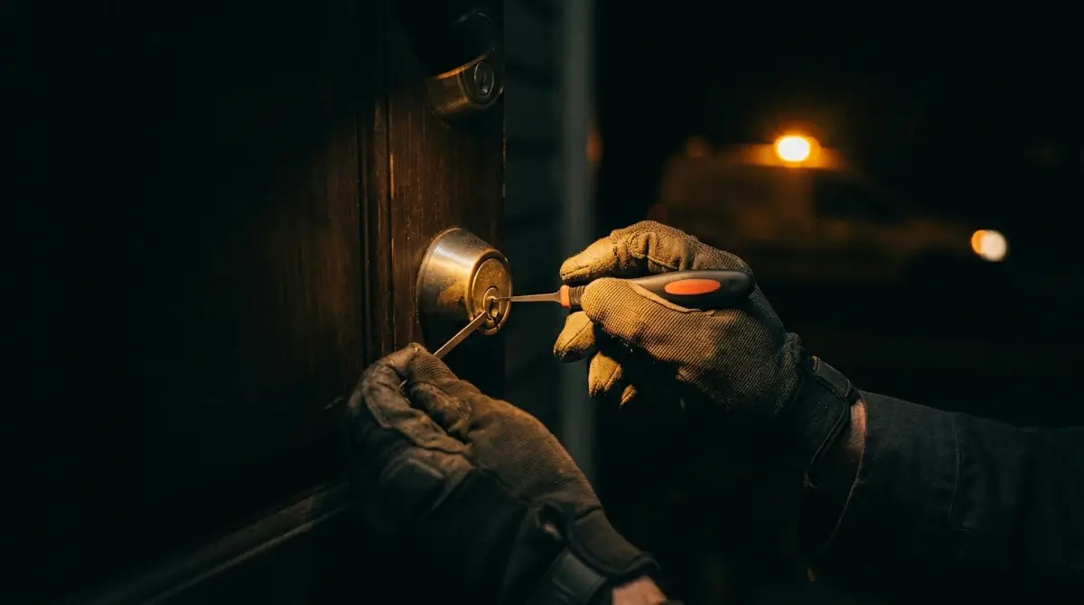 Mobile locksmith unlocking a door during an emergency call in Burlington